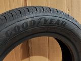 a close up of a tire on a cardboard box with a cardboard box in the background