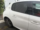 a white car that is parked in a parking lot