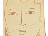 a drawing of a man ' s face on a piece of paper