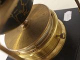 a clock that is sitting on top of a book