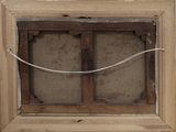 a picture of an old window with a wire in it