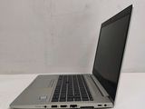 a laptop computer sitting on a table with a white background