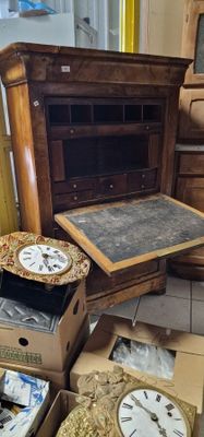 many boxes of clocks on the floor in a room