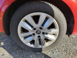 a close up of a tire on a red car