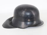 an old german steel helmet on a white background