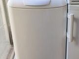 refrigerator and freezer sitting next to each other on the floor