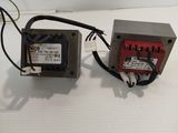 an image of a couple of power transformers sitting on top of a table