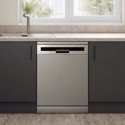 a dishwasher in the middle of a kitchen with a window