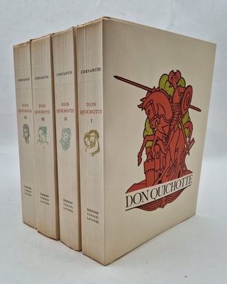 three books are stacked on top of each other on a white surface