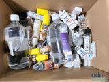 a cardboard box filled with bottles of water and other items