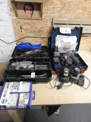 many tools on a workbench with a man ' s head in the background