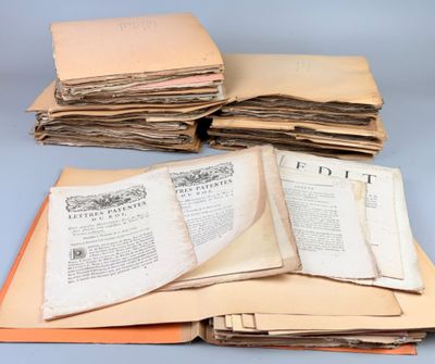 several old books stacked on top of each other on a table