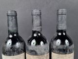 three bottles of wine sitting next to each other on a table