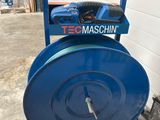 a close up of a blue hose sitting on top of a blue cart