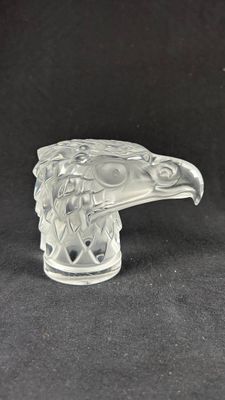 an image of a glass figurine of a bird on a black background
