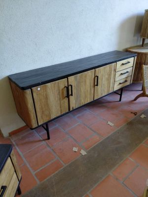 a table and a chair in a room with tile flooring