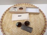 a basket with a pair of sunglasses and a pair of sunglasses on it