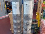 two rolls of plastic wrap on the floor in a store