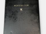 a black book with a gold crown on top of it