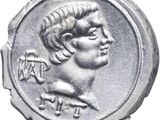 a close up of a silver coin with a man ' s face on it