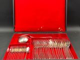 a red case with silverware in it on a table