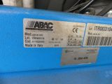 a close up of a blue machine with a barcode on it