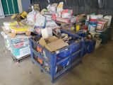 a blue crate filled with supplies in a garage