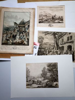 several pictures of old books on a table with papers on them
