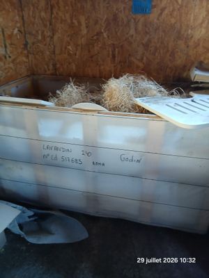 a box full of hay inside of a building
