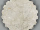 an image of a white plate with a scallop design on it