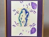 purple and white framed picture of a woman with purple flowers