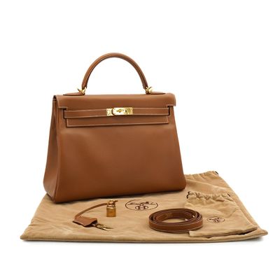 a brown leather handbag sitting on top of a piece of paper
