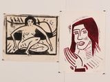 two paintings of a woman and a man are hanging on a wall