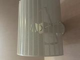 a lamp that is on a wall in a room