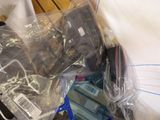 a pile of electronic equipment wrapped in plastic on a table