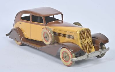 a toy car that is sitting on a white surface