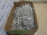 a cardboard box full of silver and silver foil