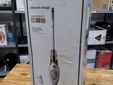 Boîte d'un balai vapeur Black & Decker posée sur une table dans un magasin