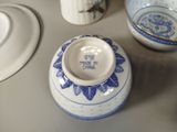 a small blue and white vase sitting on a table