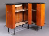 a wooden cabinet with a black top and a shelf