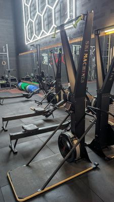 a gym with a lot of equipment in the room