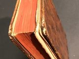 an old book that is sitting on a table