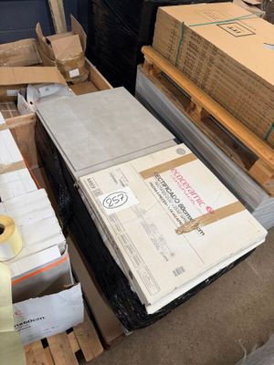 a pile of boxes that are sitting on a pallet