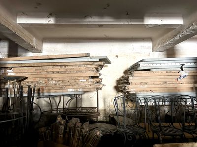many chairs and tables in a room with a lot of wood