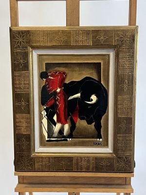 a picture of a painting of a bull on a easel