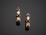 a pair of sapphire and diamond earrings