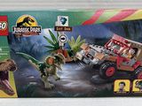 the box is open to show the contents of the lego jurassic park set