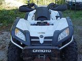 an image of a white and black atv parked in a lot