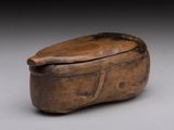 an old wooden box with a lid sitting on a table