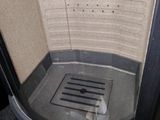 an image of a bathroom with a sink and a shower